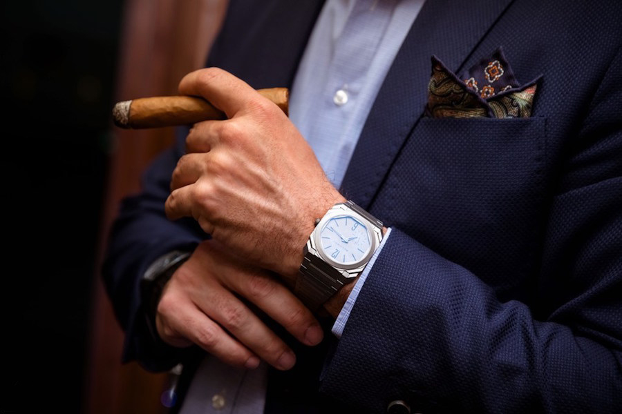 Cigar, suit and watch image for marketing with teeth